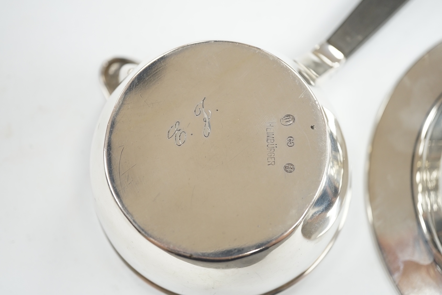 A 1940's Danish white metal bowl and small saucepan with wooden handle, the latter stamped Heimburger, gross 8.4oz. Condition - fair